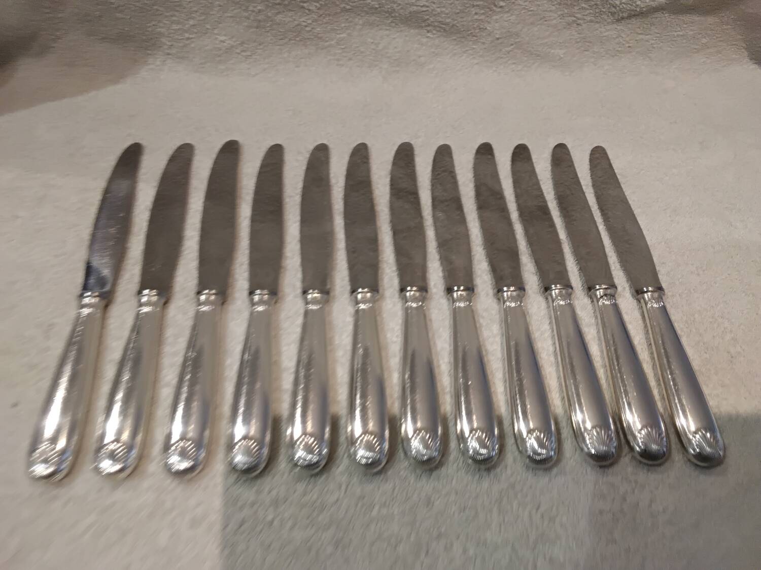 12 silver-plated table knives by Christofle Vendôme, 24.5cm