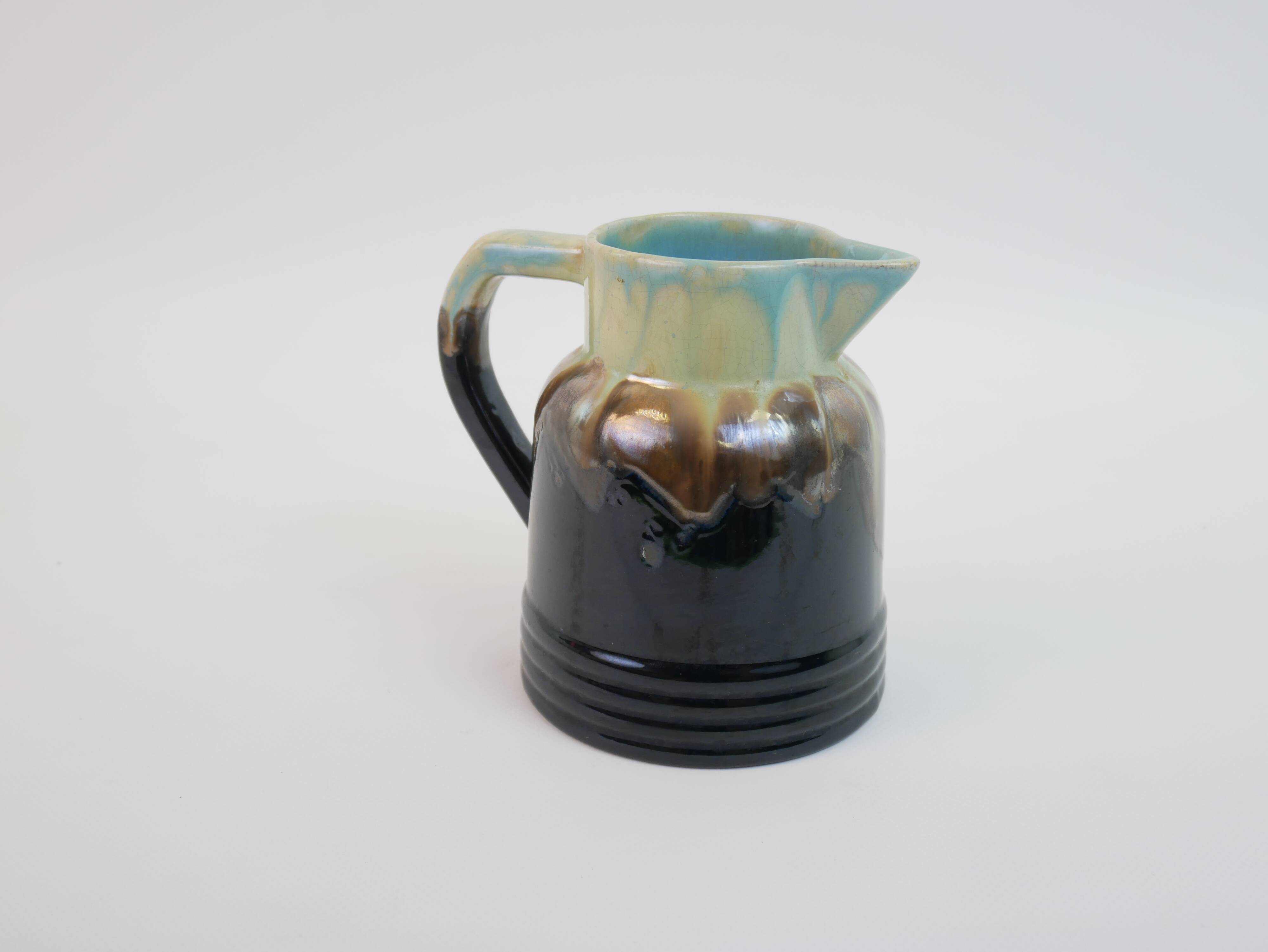 Art Deco pitcher in black, brown and blue glazed ceramic