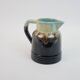 Art Deco pitcher in black, brown and blue glazed ceramic