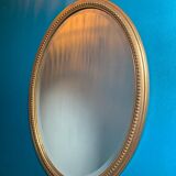Vintage beveled gold oval mirror