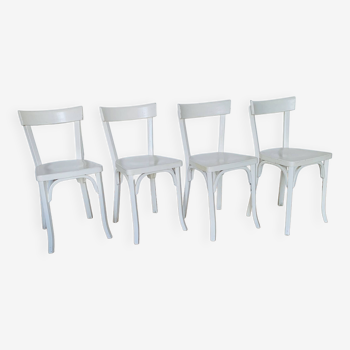 Set of 4 Baumann white chairs