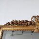 Miroir de cheminée en bois doré à décor de nœud et de roses H : 164 cm
