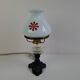 1960s Czechoslovakian milk glass oil lamp style table lamp with red windmill