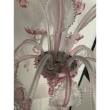 Chandelier in transparent and pink Murano-style glass with flower and leaf.