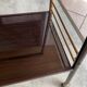TV stand on casters, 2 brown Formica shelves, 1960s