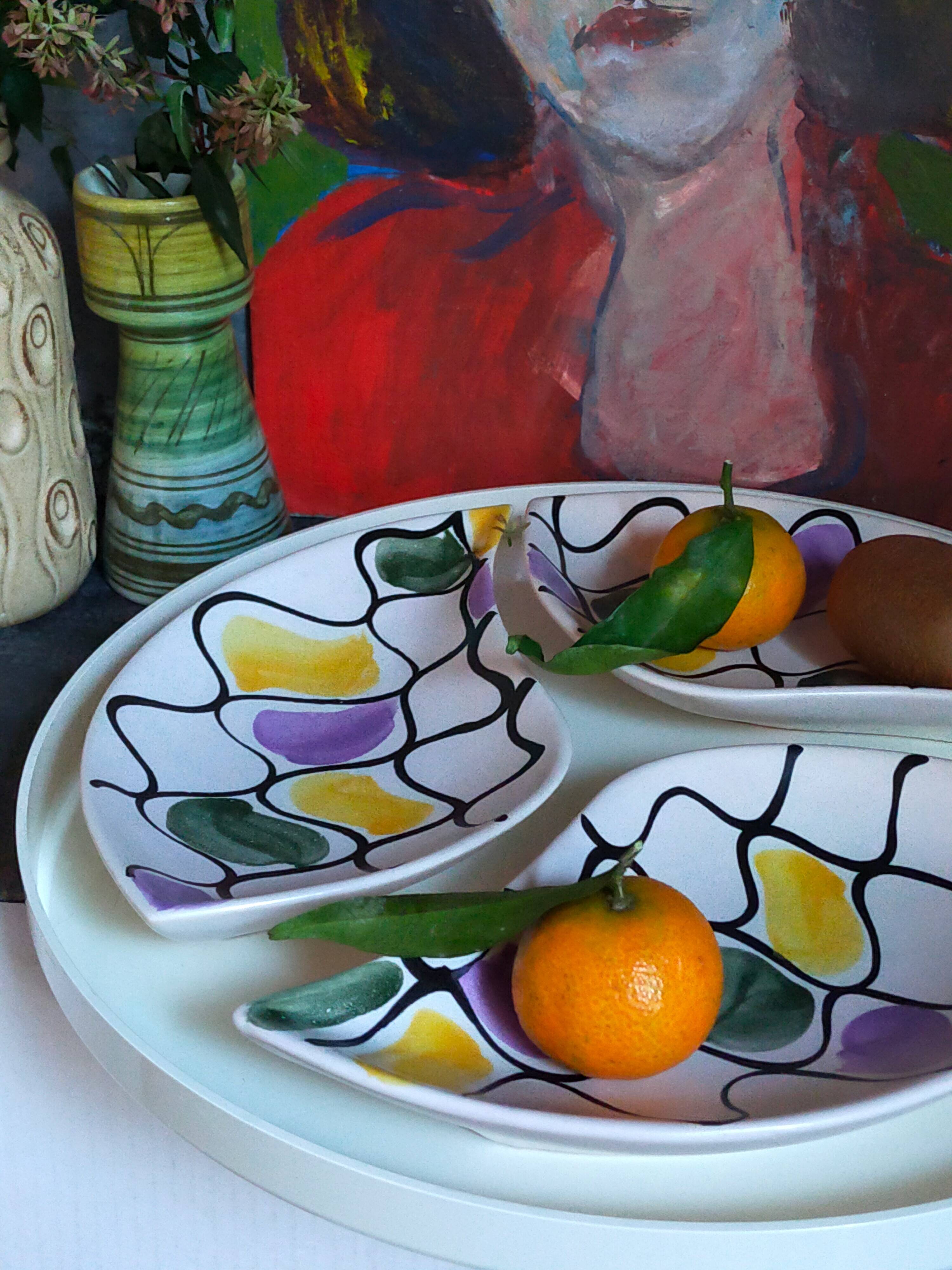 Three vintage free-form ceramic ravine dishes from the 1950s