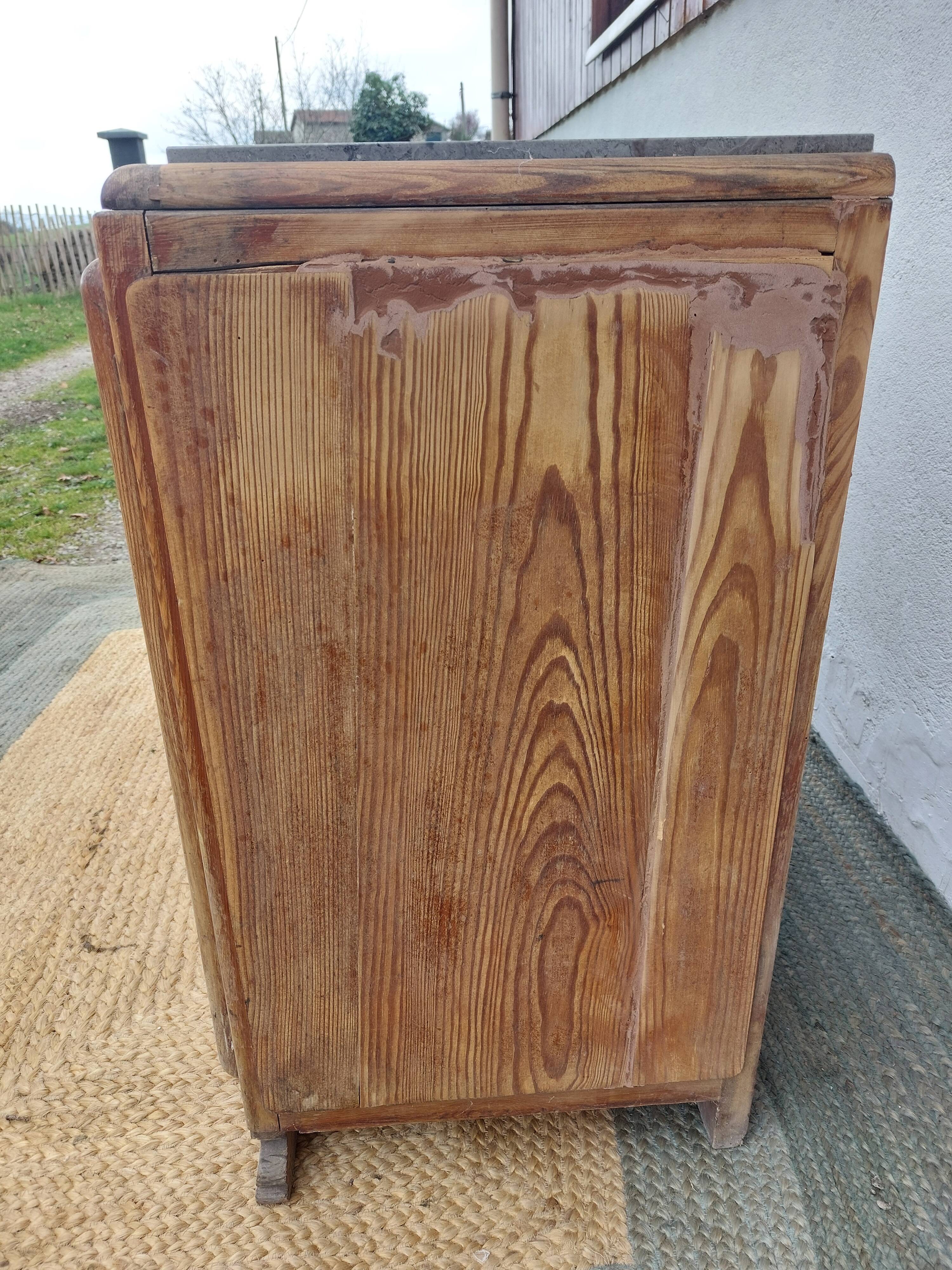 Vintage wooden buffet with a marble top.