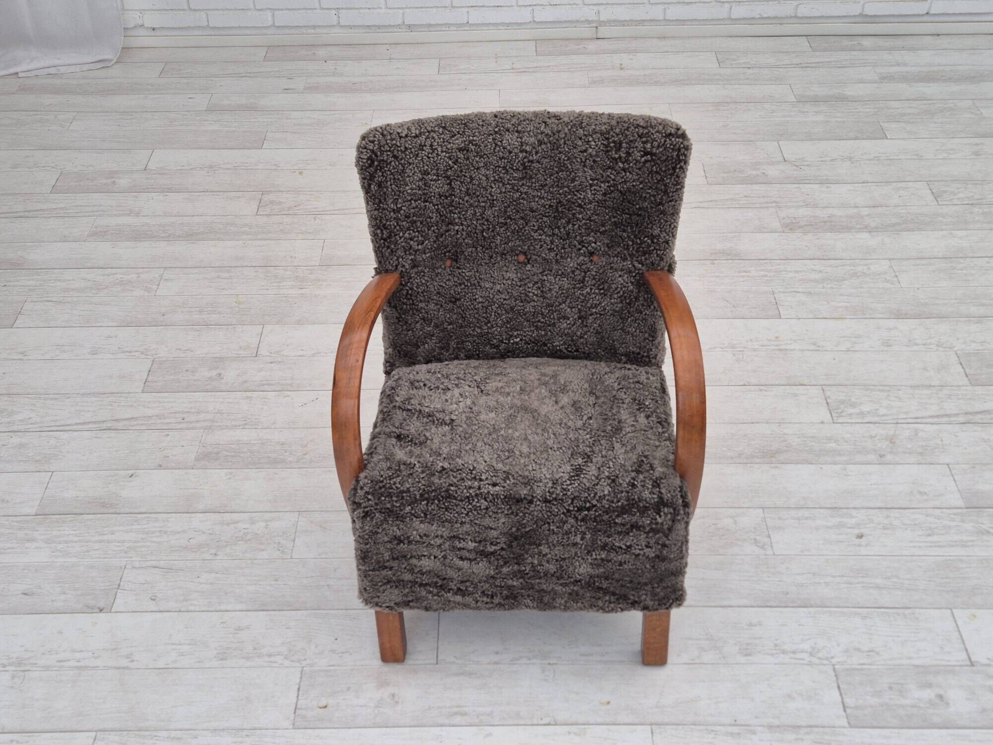 1960s, completely reupholstered Danish art deco armchair, genuine sheepskin "Wellington".