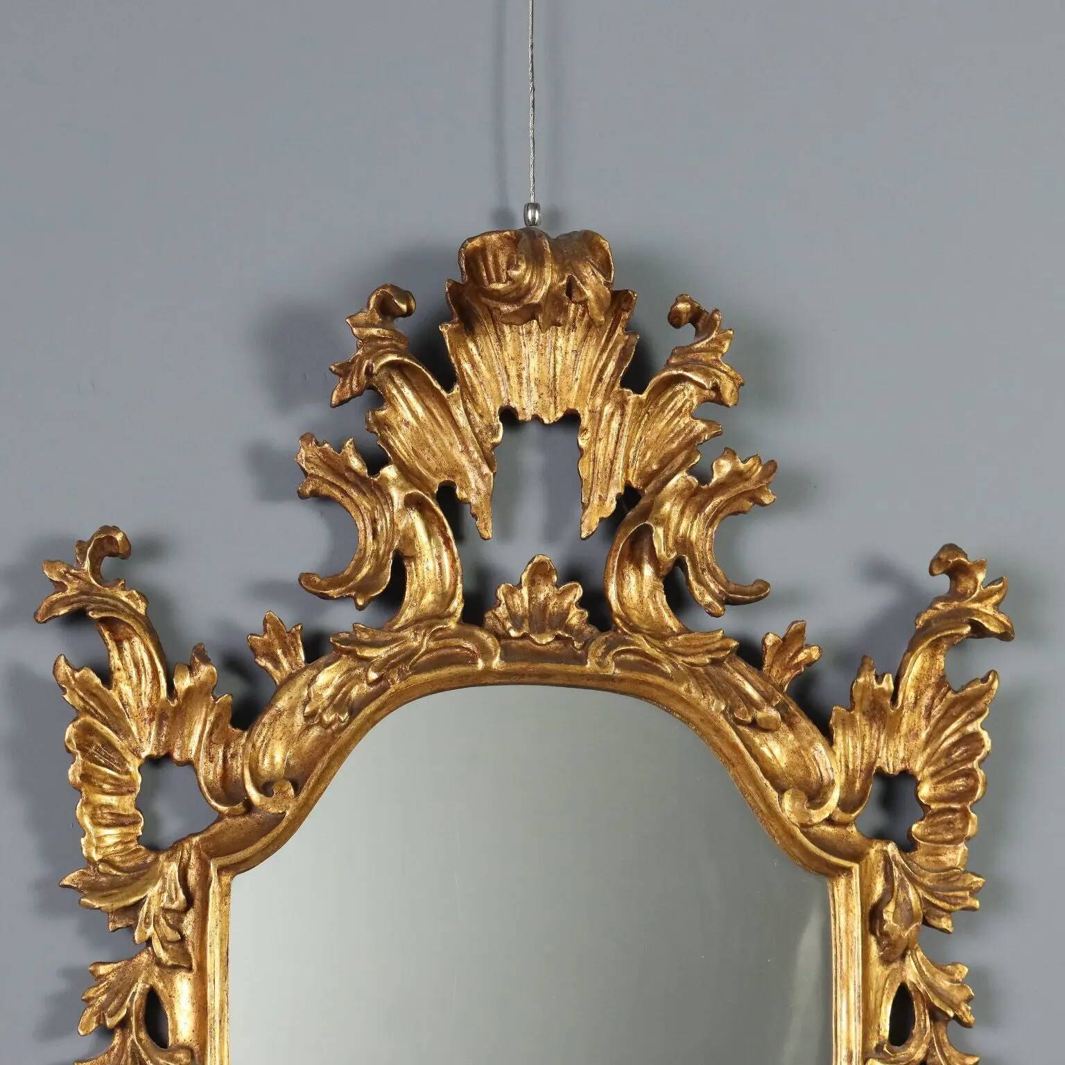 Antique carved and gilded wooden mirror, Italy, late 19th century.