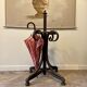 Umbrella holder in arched and dark wood