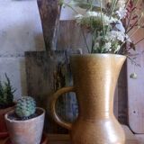 Vintage pitcher with enamelled earth cove