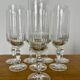 Set of 8 crystal champagne flutes in classic design.