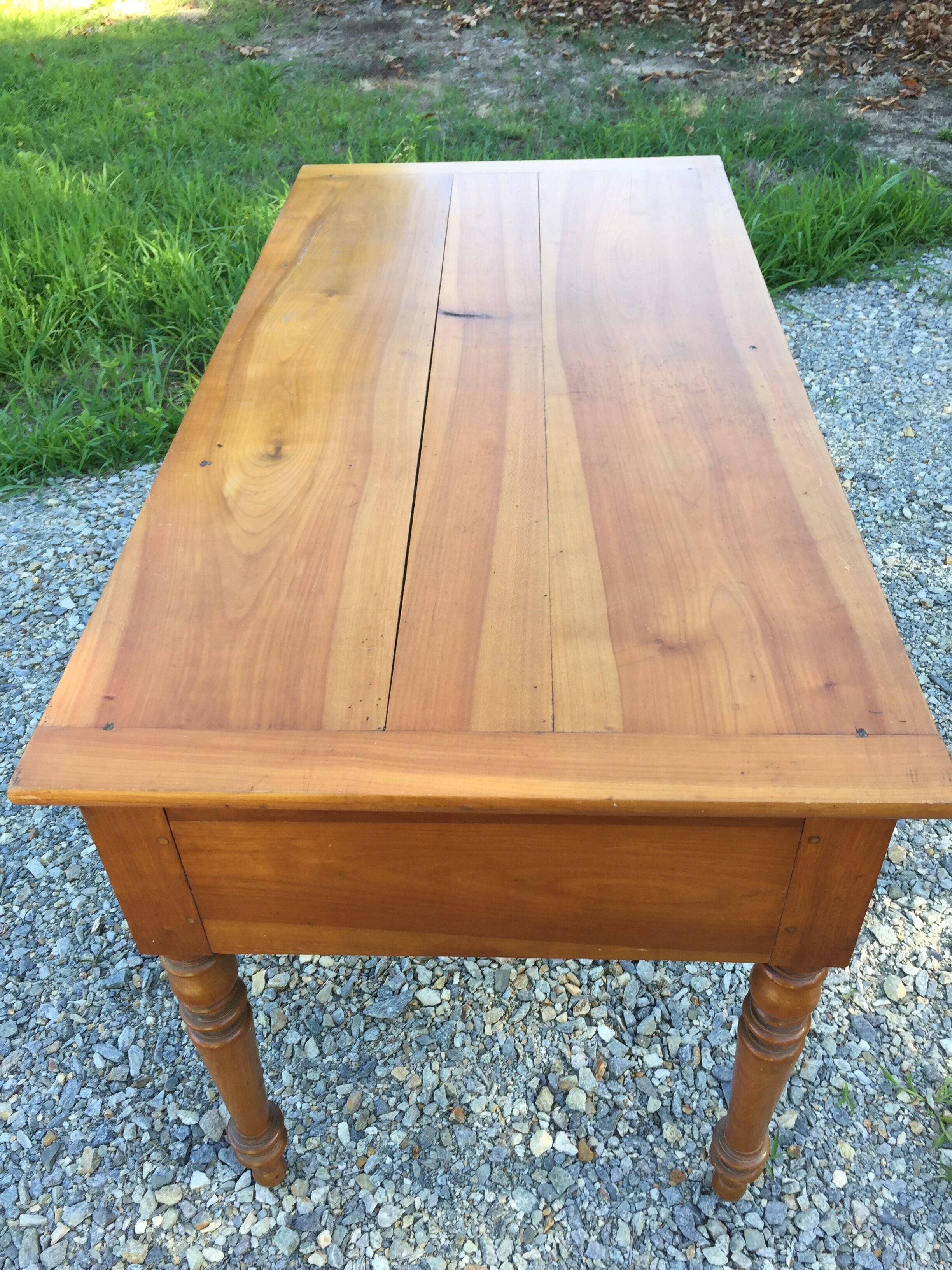 Old farmhouse table louis Philippe style in solid cherry with turned feet.