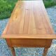 Old farmhouse table louis Philippe style in solid cherry with turned feet.