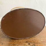 Metal wastebasket with bird decoration