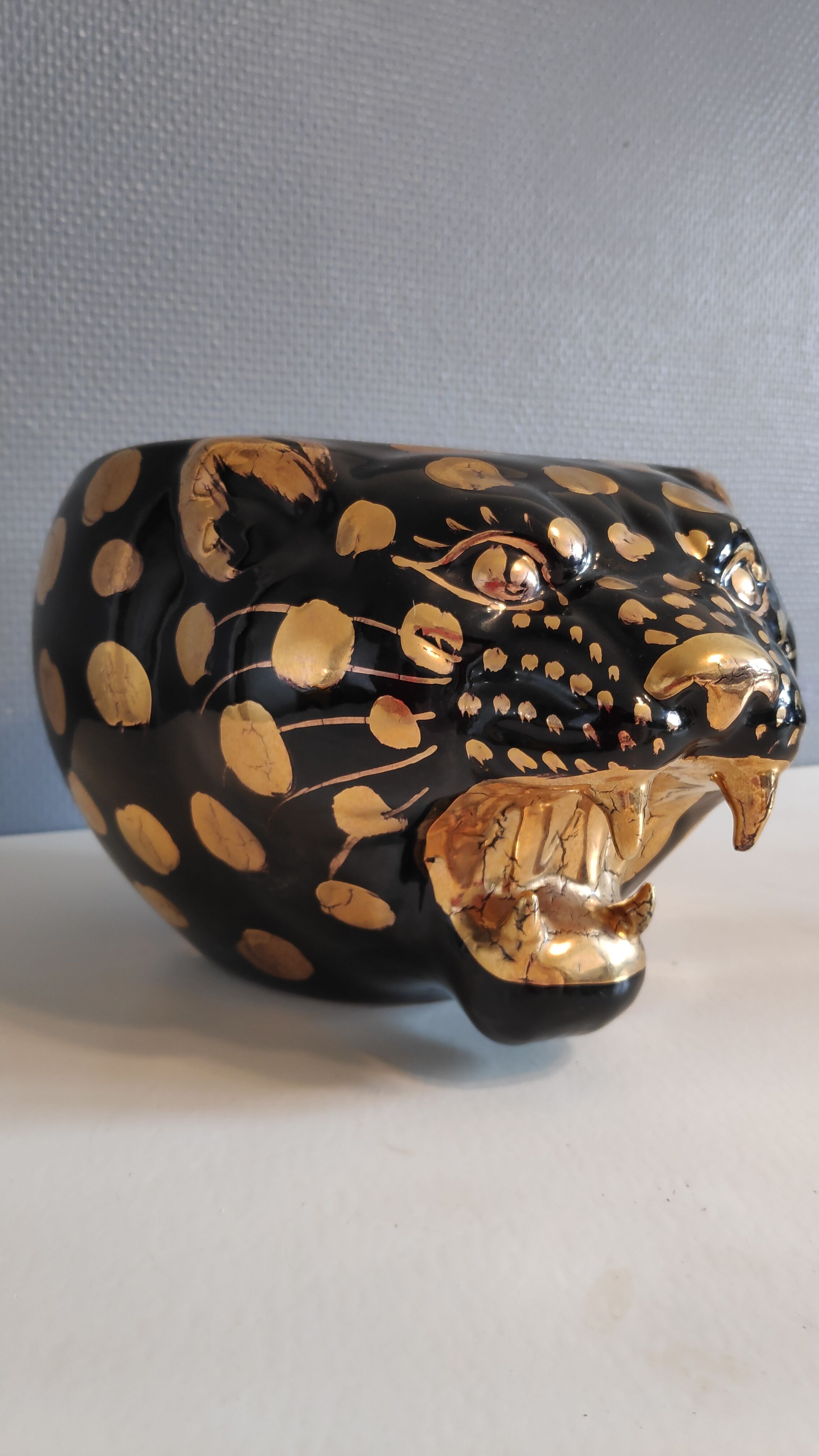 black and gold ceramic panther pot cache