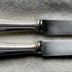 Set of 10 modernist silver-plated metal table knives.