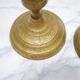 Pair of vintage candle holders in golden brass