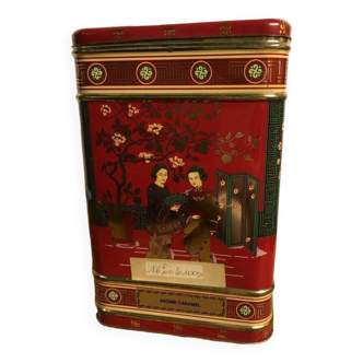 Old large empty commercial tea box with Asian decor. “Caramel flavor”.
