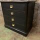 Old black patinated chest of drwers