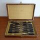 12 vintage Pradel cheese knives horn and stainless steel handles in case