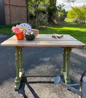 Old table with patinated green legs