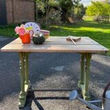 Old table with patinated green legs