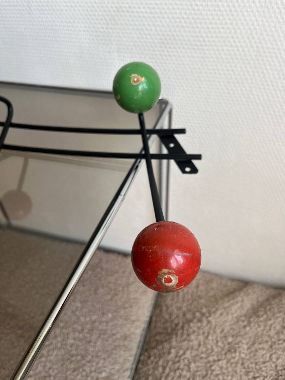 Iron wall coat rack and wooden hooks from the 60s