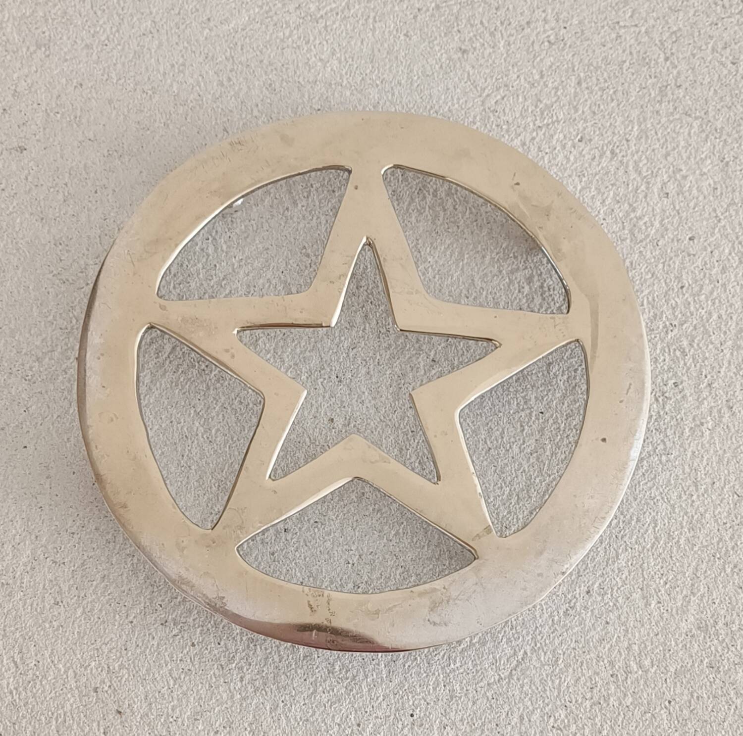 Star brass trivet