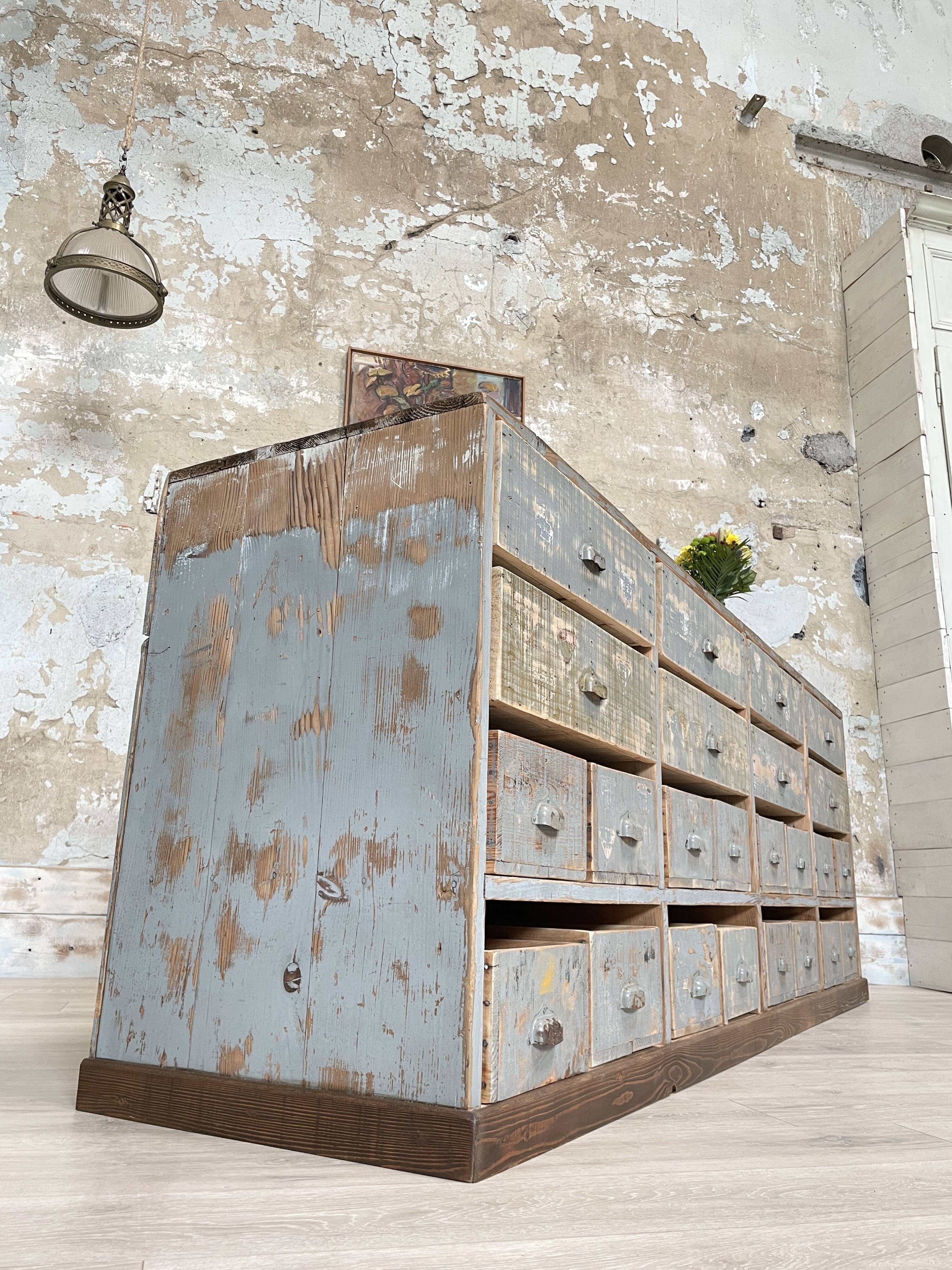 Artisanal workshop bank in patinated wood, circa 1950.