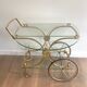 Neo classical style table in silver and gold metal and glass