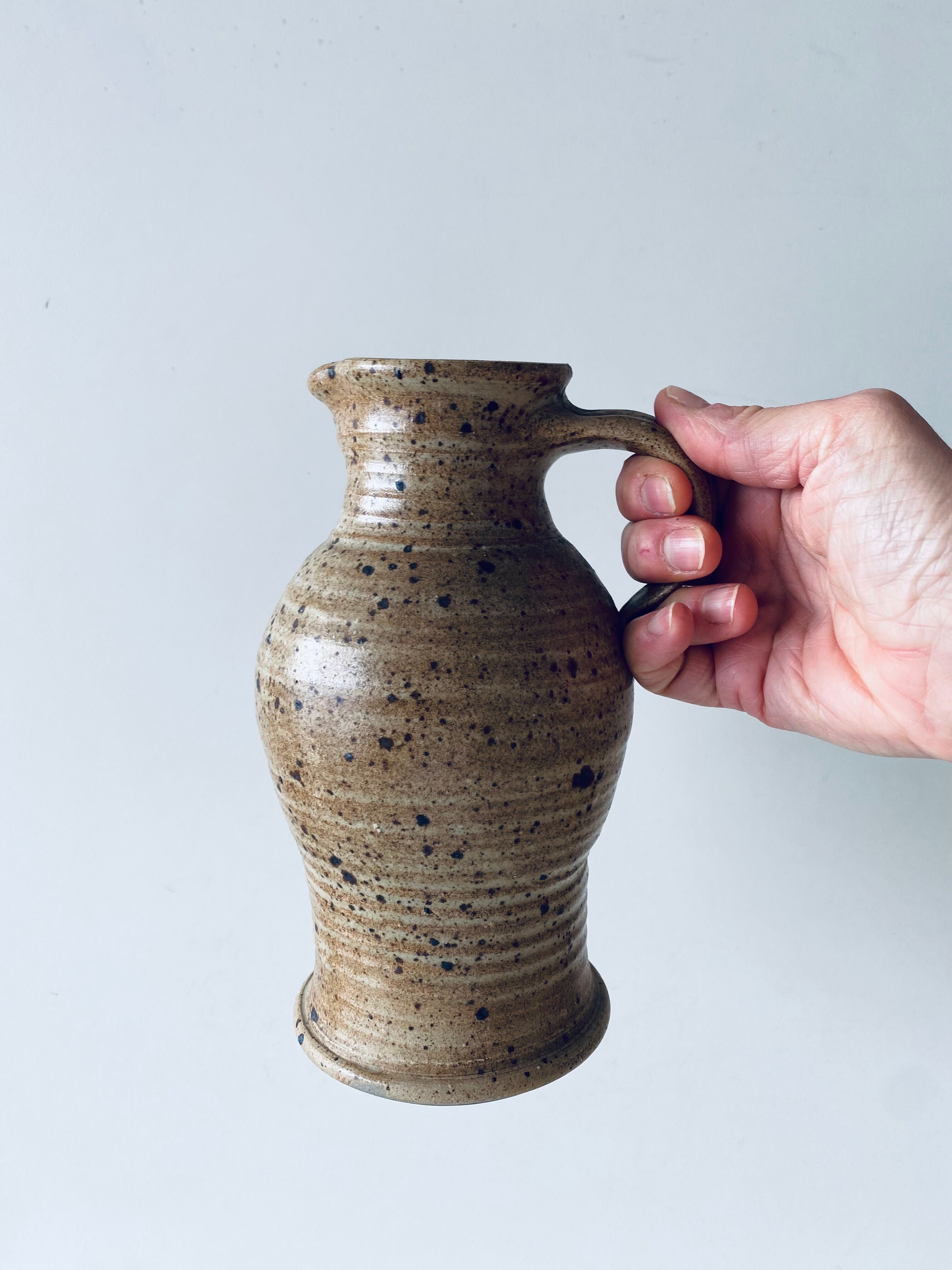 Pitcher in sandstone pyrity signed