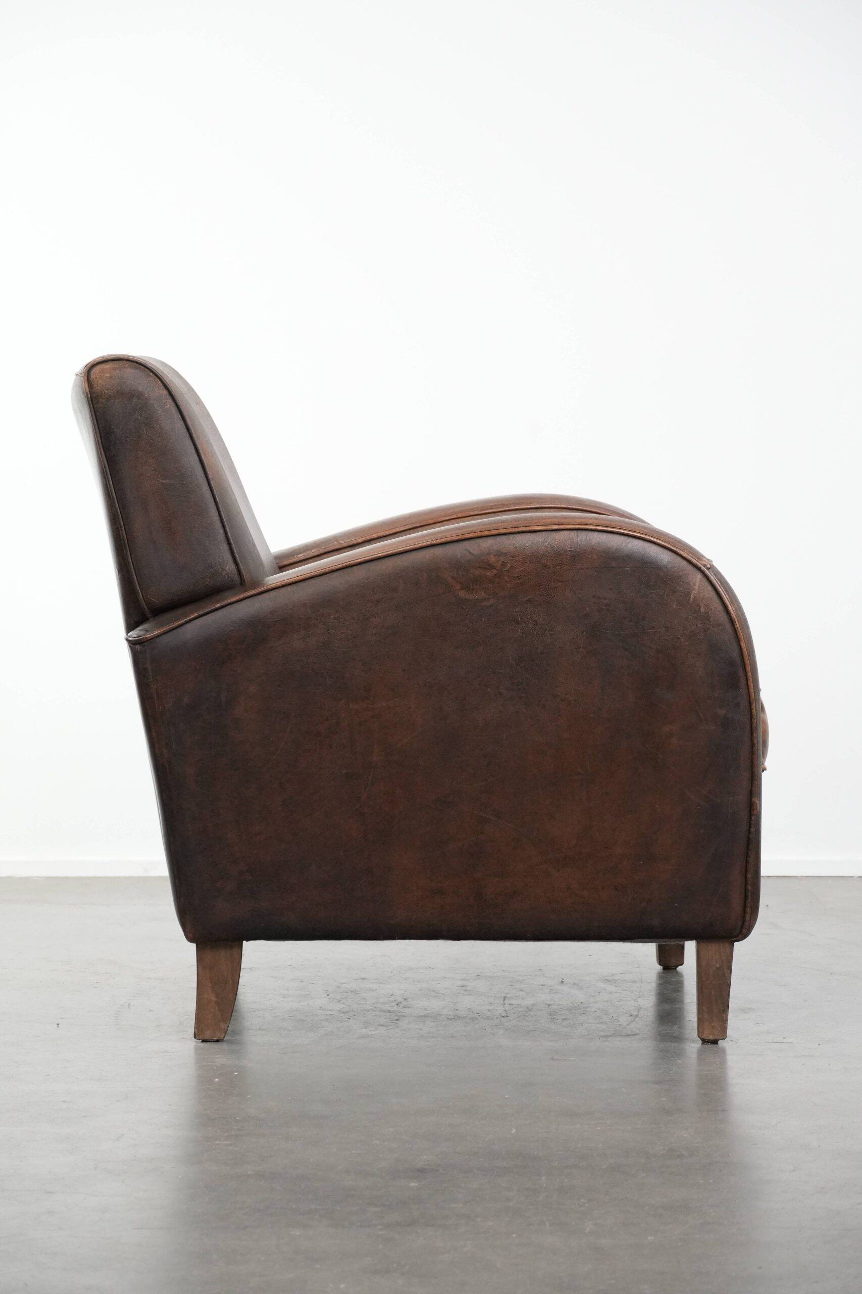 Vintage sheepskin leather design armchair in a dark cognac colour
