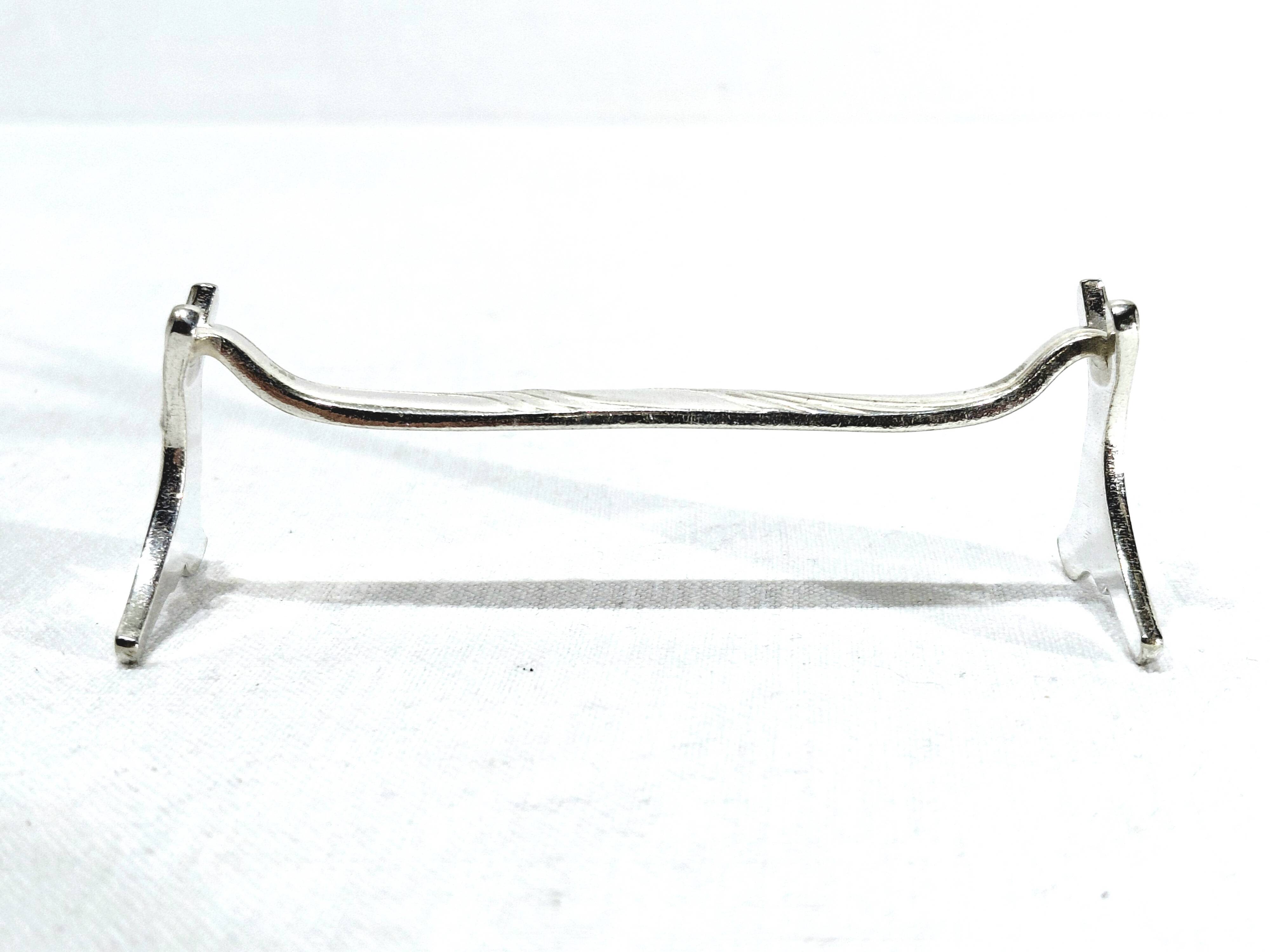 CHRISTOFLE - SET OF 11 SILVER-PLATED KNIFE RESTS