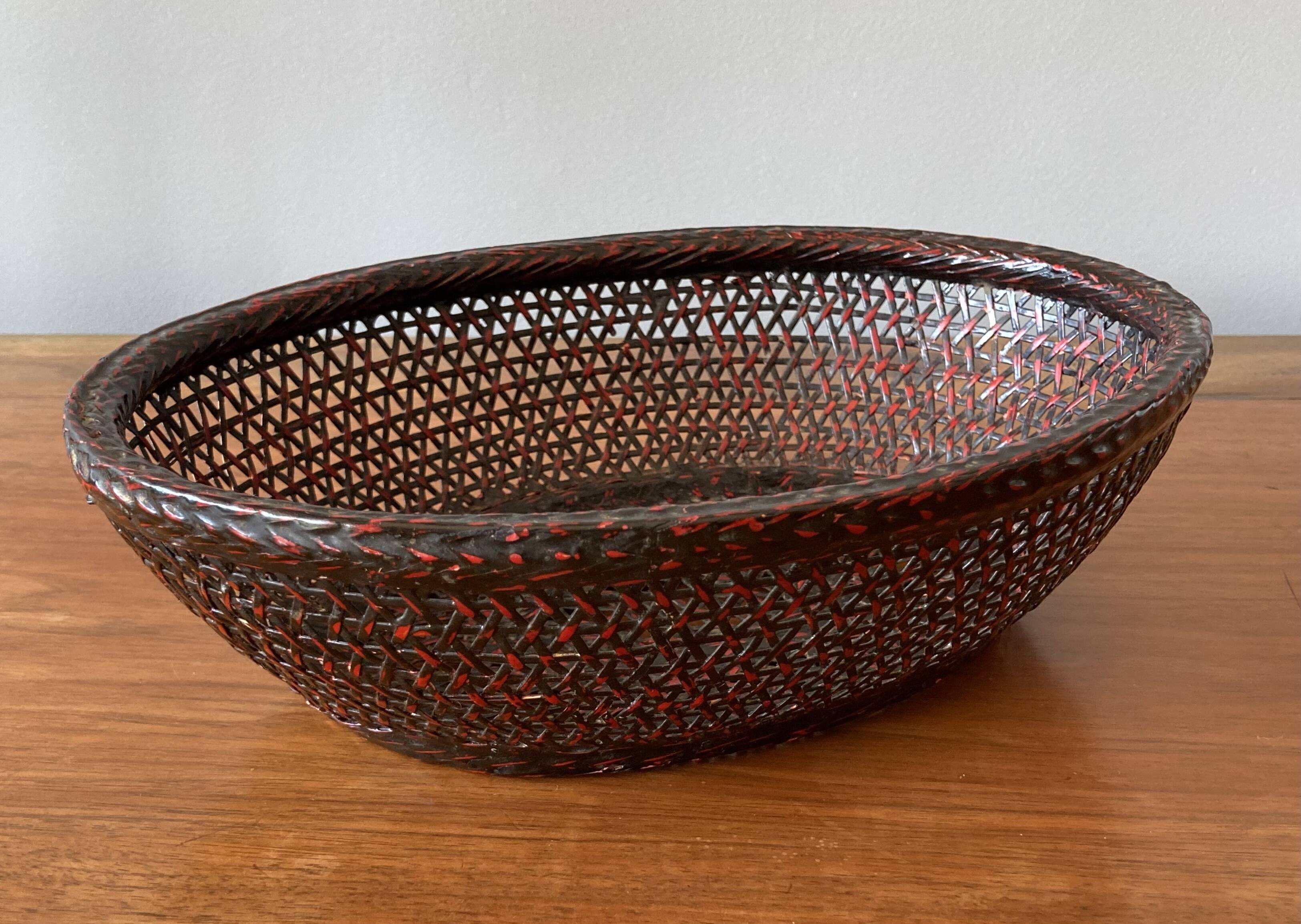 Japanese oval basket in negoro lacquered basketry (red lacquer on black background)