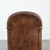 Vintage sheepskin armchair with warm colours and a characterful appearance