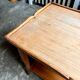 Coffee table, side table in light wood with saber legs.