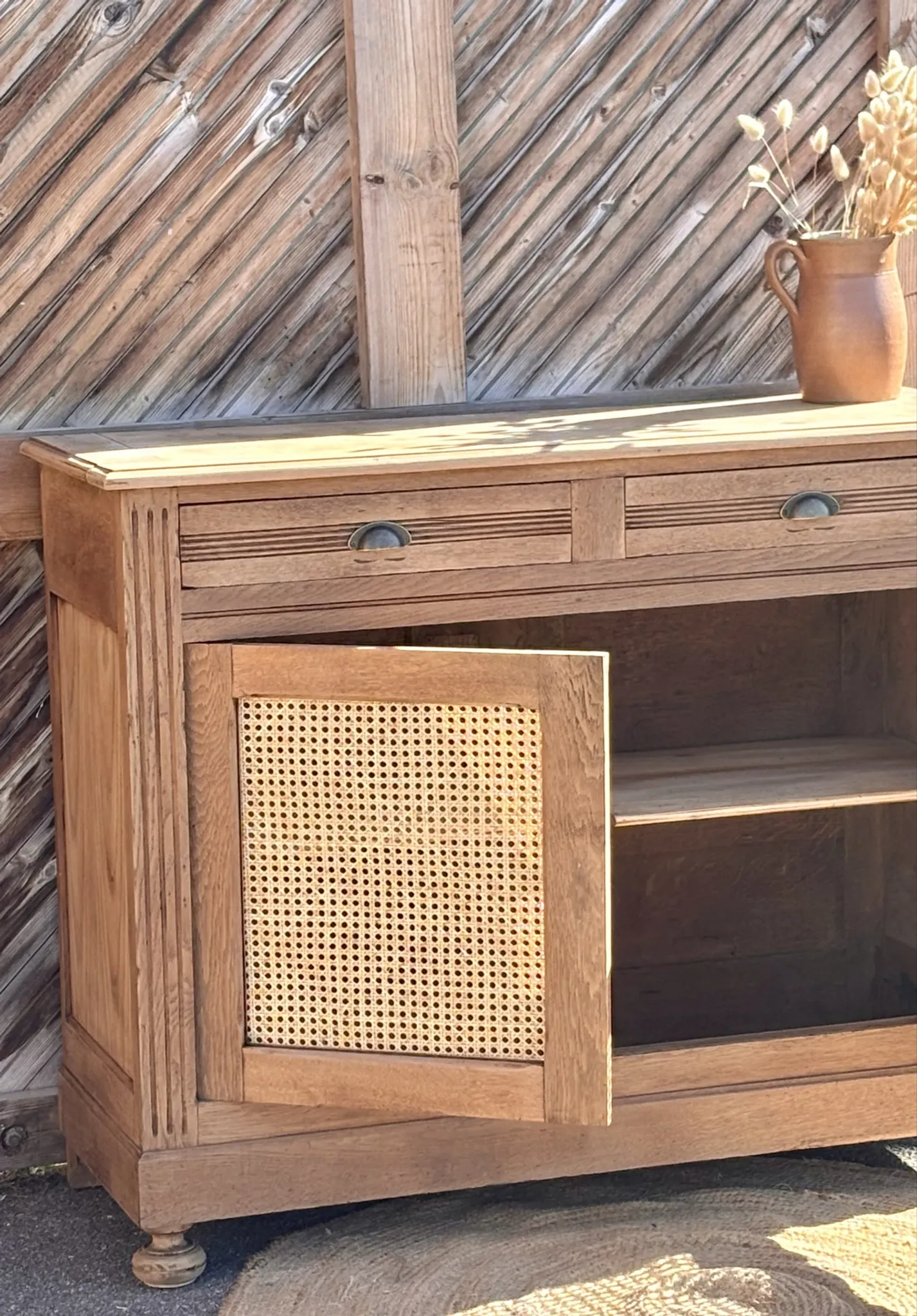 Old buffet in raw solid oak and cane.