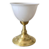 Antique white opaline glass globe table lamp with a brass base.