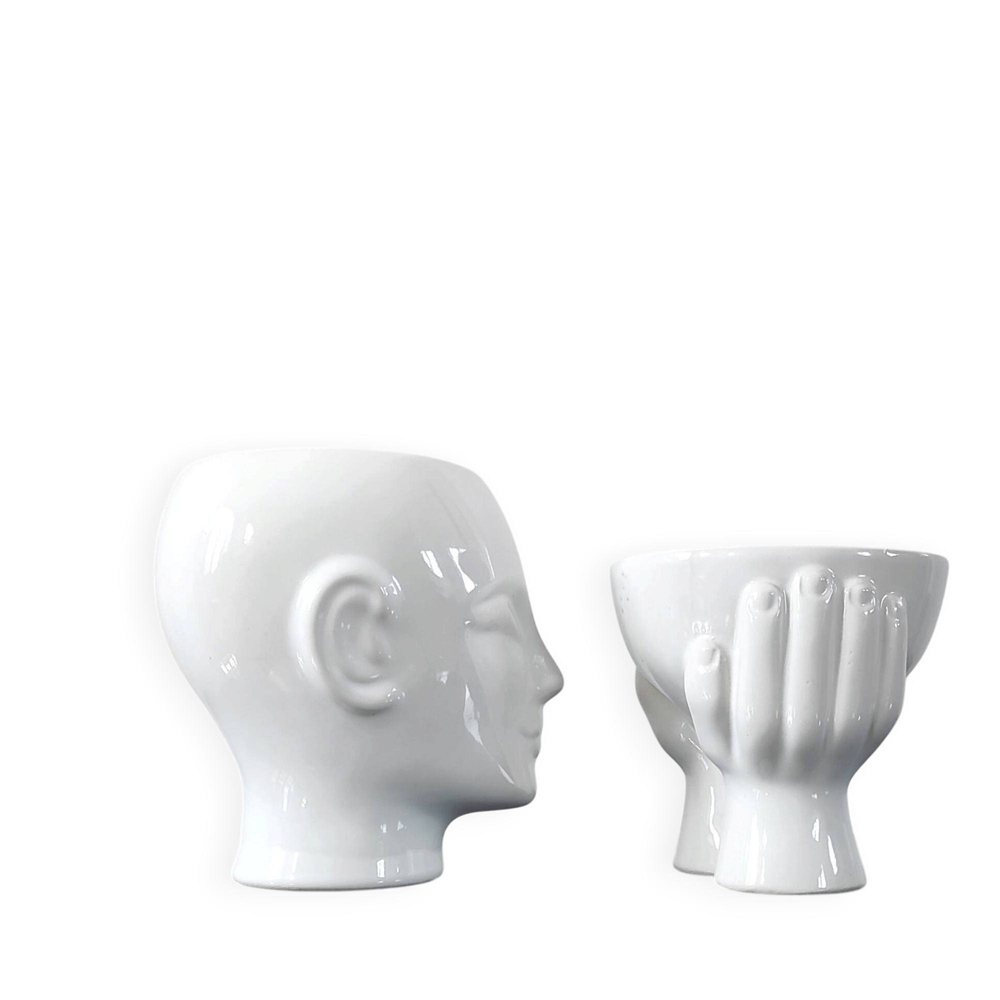 A pair of vintage ceramic plant pots.