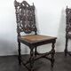 Set of 6 Henri II chairs in carved openwork oak with caned seats.