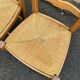 2 solid wood and rush-seated chairs in Louis XV style with shell carving from the 20th century.