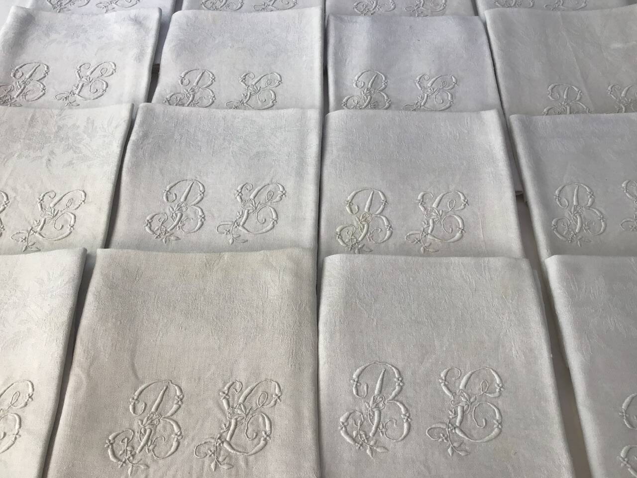 Set of 12 19th century white napkins marked “BL”