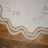 Round embroidered and crocheted doily