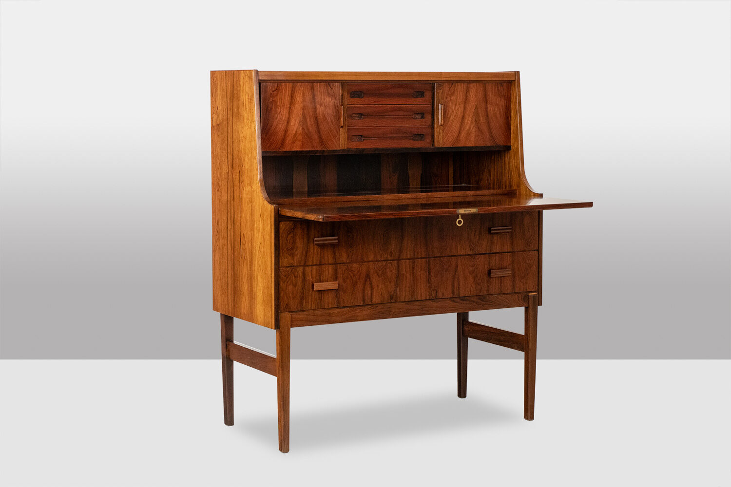 Rosewood chest of drawers with 2 drawers, forming a secretary. 1970s.