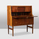 Rosewood chest of drawers with 2 drawers, forming a secretary. 1970s.