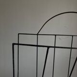 Mid-century poetic magazine rack in black metal