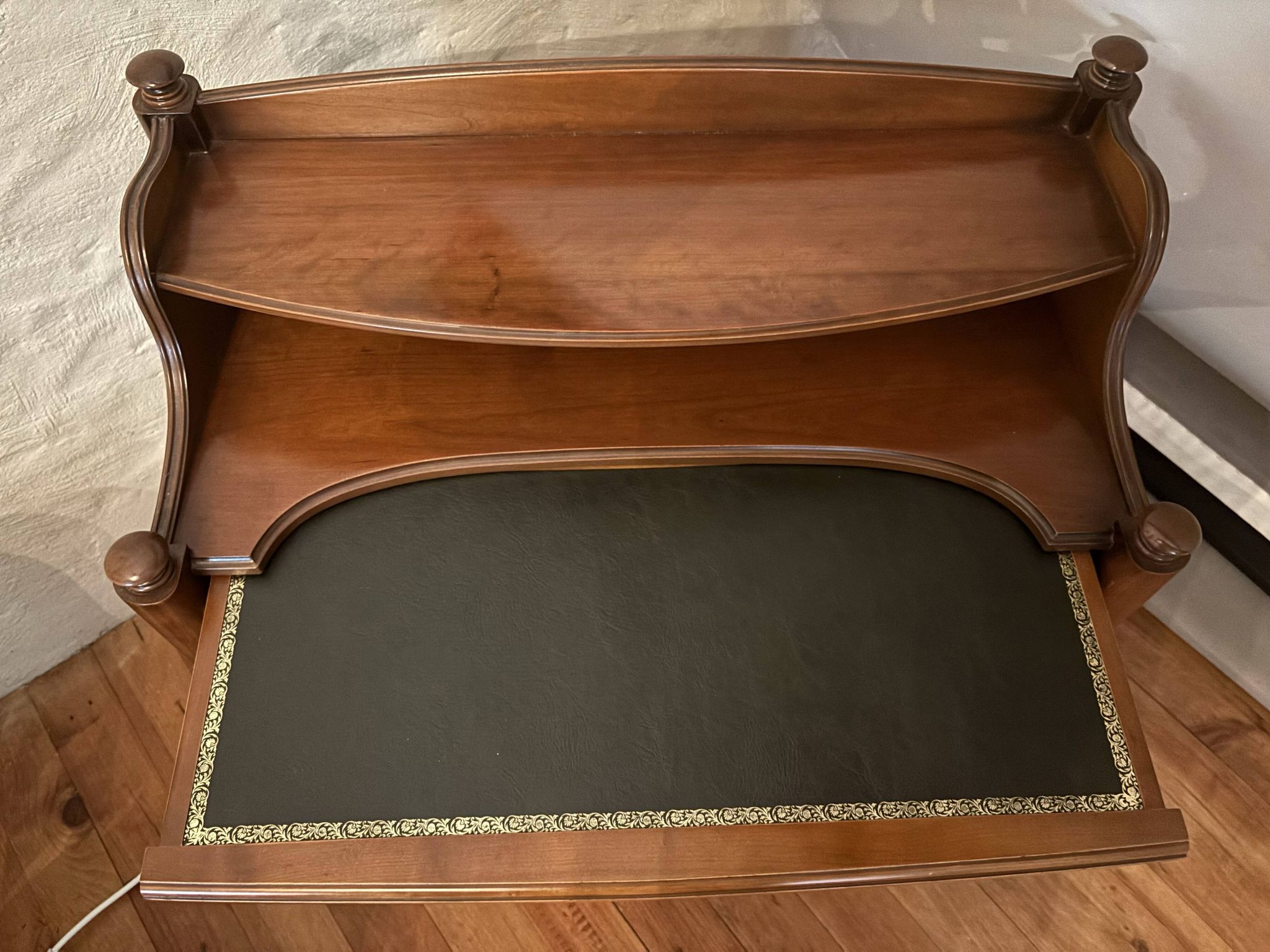Vintage drop-leaf secretary with a green leather top and inlays.
