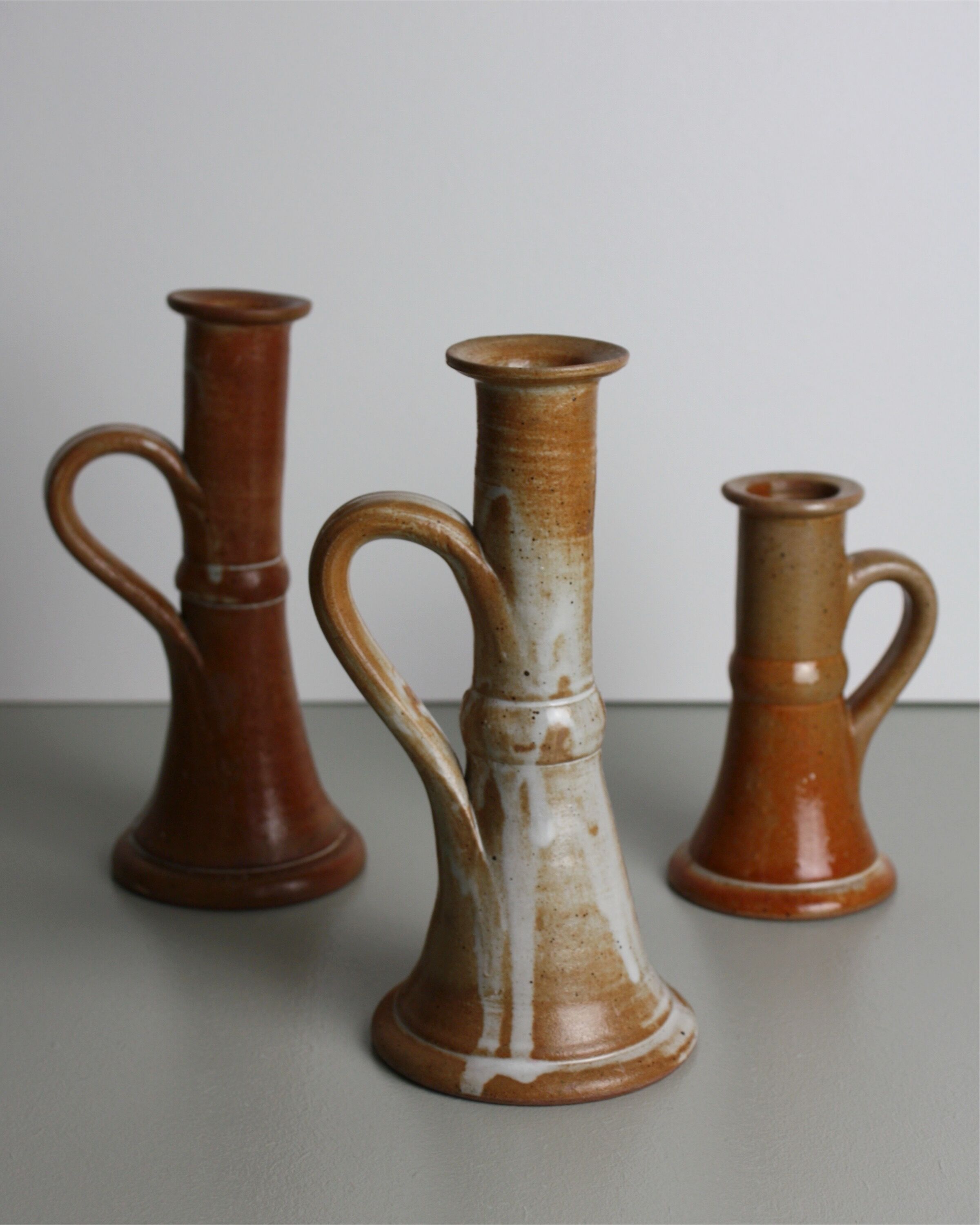 Trio of stoneware candle holders