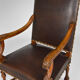 Louis XIII office armchair in leather and walnut carved around 1860